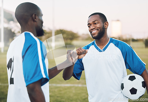 Image of Fist bump, soccer ball and black man with teamwork success of sports training on a grass field. Football friends, support and exercise with fitness motivation outdoor for health workout and smile