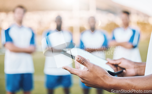 Image of Football, soccer and team statistics on a tablet and coach analysis online, internet or website on a sports field. Teamwork, digital and tactics by modern trainer tracking performance analytics