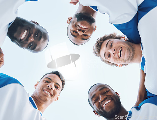 Image of Portrait, sports and a soccer team in a huddle from a low angle against a blue sky for a game. Teamwork, collaboration and fitness with a football player group standing in a circle before a match