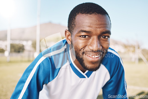 Image of Soccer, fitness and portrait of black man with smile on face with mission and mindset for winning game in Africa. Confident, proud and happy professional football player at exercise or training match