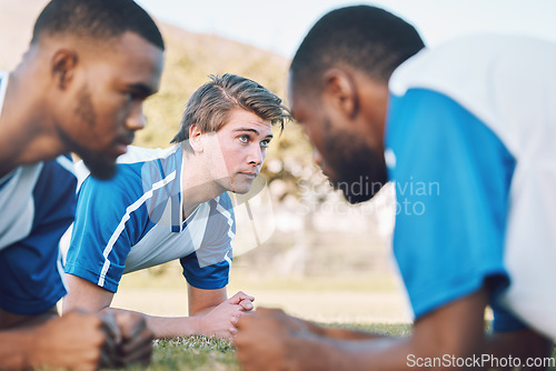 Image of Team, push up and football player coaching on field training, practice and sports challenge with muscle support. Group, soccer people or men on grass or ground for workout fitness of personal trainer