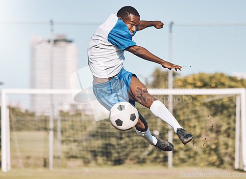 Image of Soccer, action and man jump with ball playing game, training and exercise on outdoor field. Fitness, workout and male football player kicking, running and score goals, winning and sports competition