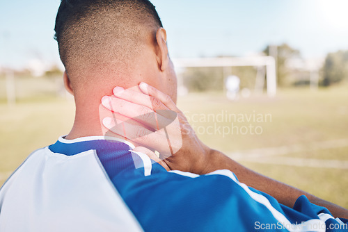 Image of Fitness, field and athlete with neck pain, injury or accident from soccer match, exercise or training. Sports, workout and football player with medical emergency or muscle sprain at outdoor stadium.