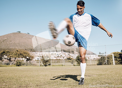 Image of Football outdoor, happy soccer player and man athlete with sports cardio, training and exercise on field. Kick, game and workout with fitness and running for wellness and health for game with energy