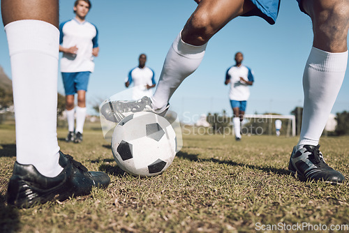 Image of Fitness, soccer team and athletes playing on the field at a game competition, league or championship. Sports, football and male sport players running with a ball at an outdoor match on soccer field.