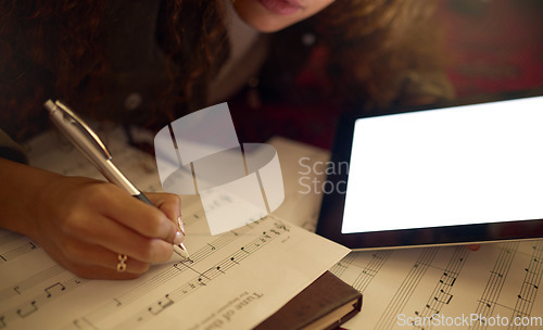 Image of Music notes, tablet and black woman writing on paper for song lyrics, audio and create track beat. Musician, creative studio and hand of girl write on sheet with mockup digital screen for musical app