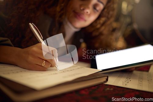 Image of Tablet, paper and black woman writing music notes for song lyrics, audio and create track beat. Musician, creative studio and hand of girl write on sheet with mockup digital screen for musical app