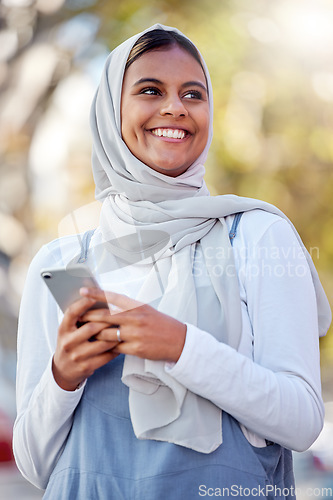 Image of Hijab, phone and thinking of a girl teenager happy outdoor with mobile connection and networking. Islam, muslim and young person ready for social media network scroll with technology and happiness