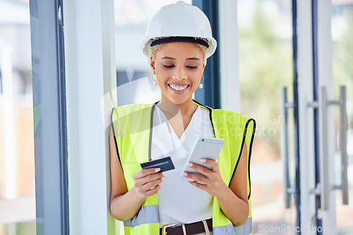 Image of Construction worker, woman and ecommerce with credit card and smartphone, happy with payment and bank. Internet, banking and online shopping with contractor, stock purchase with retail and mobile app