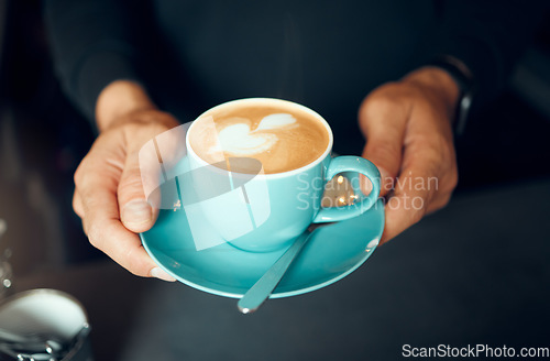 Image of Barista hands, coffee and foam heart for customer, waiter working and server in small business restaurant. Man, creative shape in cappuccino or milk latte mug from espresso machine in cafe shop