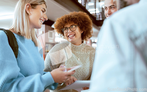 Image of Happy, education or students with phone in library for research, collaboration or project management. Smile, documents or university people group on tech for learning, scholarship study or web search