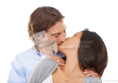 Image of Couple, kiss and affection for valentines day, love or embracing relationship isolated against a white studio background. Happy man and woman kissing lips for intimate romance, bonding or embrace