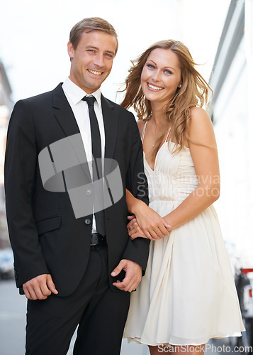 Image of Valentines date, love and couple portrait with a smile ready for romance and happiness on a street. Suit, smile and happiness of a fancy woman and man together with care on dates for engagement