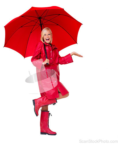 Image of Portrait, red raincoat and umbrella for insurance with a woman in studio isolated on a white background. Winter, rain and weather with an attractive young female on blank space to promote life cover