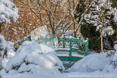 Image of beautiful winter garden covered by snow