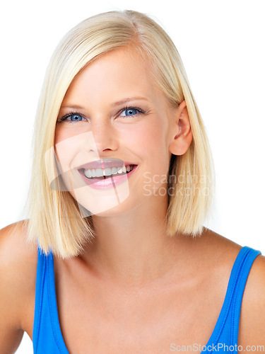 Image of Happy, smile and portrait of a woman in a studio with happy, optimistic and positive mindset. Happiness, excited and face of female model from Australia with blonde hair isolated by white background.