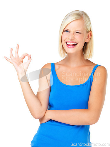 Image of Happy woman, portrait smile and OK sign for approval, satisfaction or perfection isolated against a white studio background. Blond female standing and showing okay hand gesture with wink for good job