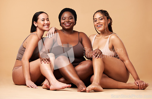 Image of Diversity, women friends and body portrait with skin glow group together for inclusion, beauty and power. Underwear model people on beige background with a smile, pride and motivation for self love