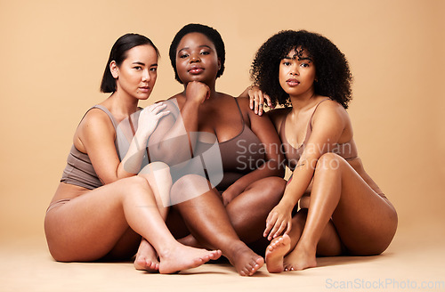 Image of Body, skin and portrait of diversity women friends together for inclusion, beauty and power. Aesthetic model group on beige background for skincare glow, pride and motivation for underwear self love