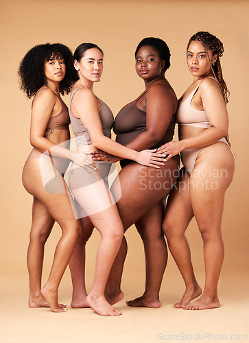 Image of Diversity women, portrait and body positivity friends hug for inclusion, beauty and power. Underwear model group beige background for cellulite legs, pride and motivation for self love or skin care