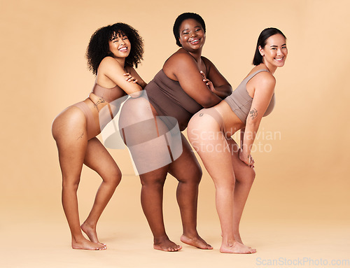 Image of Diversity women, body size and portrait of group together for inclusion, beauty and power. Underwear model friends happy on beige background with cellulite legs, skin pride and self love motivation
