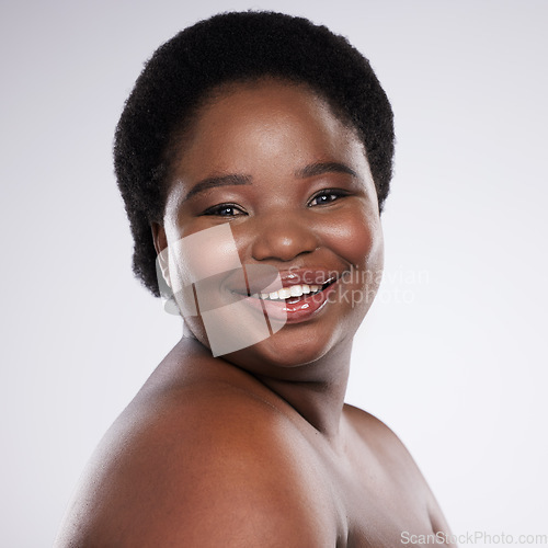 Image of Black woman, portrait and face in skincare beauty with teeth, cosmetics or makeup against a gray studio background. Happy African American female smile in satisfaction for self love, care or facial