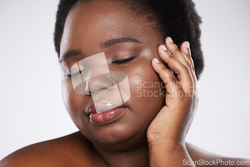 Image of Makeup, beauty and young black woman with hands and face zoom for spa and skincare aesthetic. White background, isolated and studio model with skin glow from dermatology and facial wellness results