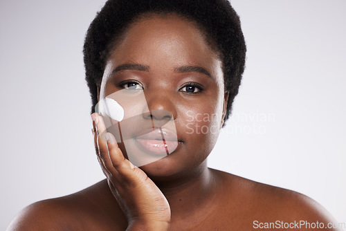 Image of Black woman, skincare cream and studio portrait for cosmetic beauty, pride and happiness by background. Facial health product, young african model and natural skin glow with self care dermatology
