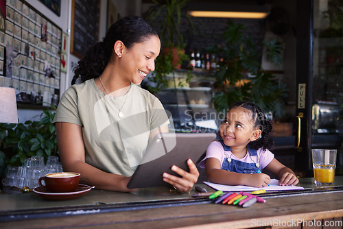 Image of Black family, children and remote work in a coffee shop with a mother and daughter sitting together by a window. Kids, tablet and freelance business with a woman and female child bonding at a cafe