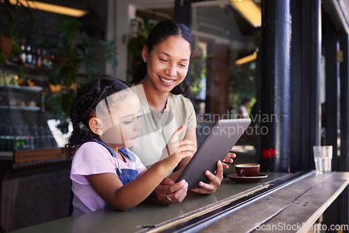 Image of Tablet, coffee shop and happy mother with her child reading the online menu before ordering. Technology, internet and mom on a date with her girl kid with a touchscreen mobile device in a cafe.