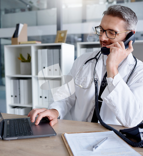 Image of Laptop, man and doctor on phone call, talking or chatting to contact for consultation in hospital. Telehealth, telephone and mature male medical professional networking, conversation or discussion.