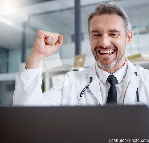 Image of Laptop, man and doctor in celebration of success in hospital for healthcare goals, health achievement and wellness targets. Computer, medical winner and mature physician celebrating winning victory