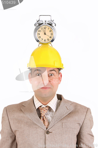 Image of businessman clock alarm on his head 