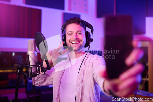 Image of Singer in recording studio, selfie and portrait with peace hand sign, music with mic and headphones. Social media content, happy in picture and audio, podcast or radio dj with man smile with phone