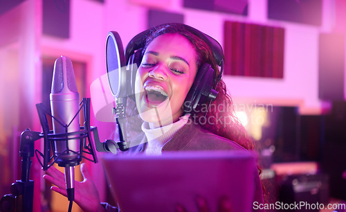 Image of Technology, singing or musician on neon microphone, music studio lyrics or songwriting app in night recording. Singer, woman or artist on tablet in production, voice media or sound light performance