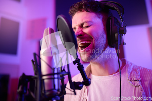 Image of Musician, singing or man on neon microphone, music studio equipment or practice in theatre night recording. Singer, person or artist on production, voice media or sound performance in light theater