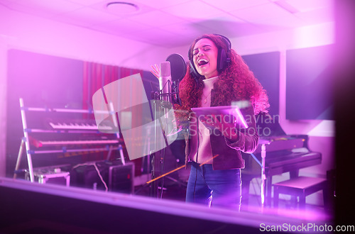 Image of Technology, singing or woman on neon studio microphone, music lyrics or songwriting app in night recording. Singer, musician or artist on tablet in production, voice media or sound light performance