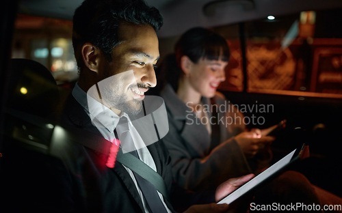 Image of Tablet, business people and man travel in car while on social media, internet browsing or web scrolling. Transport, night and male and woman with mobile technology for networking, typing or texting.