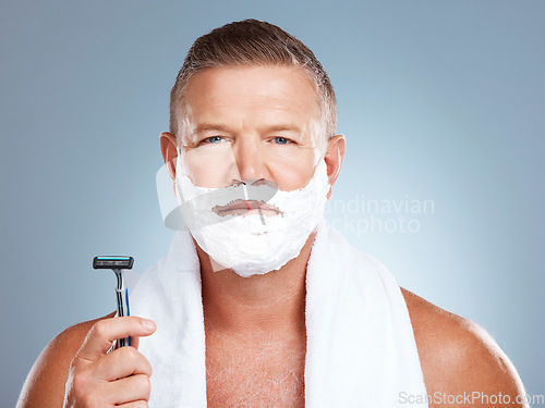 Image of Portrait, razor and old man shaving in studio with foam, skincare or beauty on grey background. Face, blade and mature male model relax for luxury, hair removal and facial, skin and product isolated