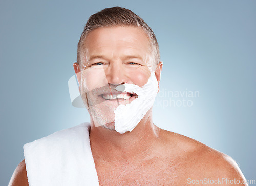 Image of Shaving cream, portrait and happy old man in studio for skincare, grooming or beauty on grey background. Face, foam and hair removal for mature model smile for luxury, skin or beard product isolated