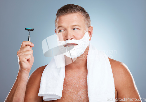 Image of Razor, skincare and old man shaving in studio with foam, beauty or grooming on grey background. Face, blade and mature male model relax for luxury, hair removal and facial, skin and product isolated