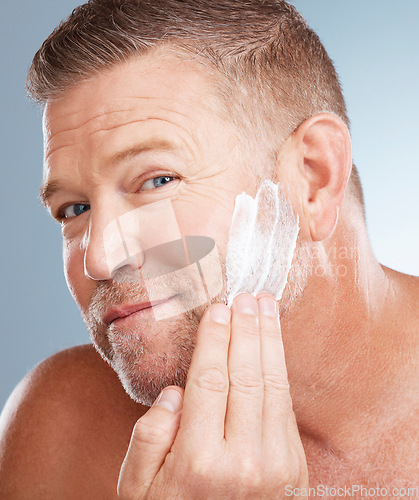 Image of Old man, portrait and shaving cream product in studio for skincare, grooming and grey background. Face, foam and skin treatment by mature male model relax with luxury, hair removal and beard care