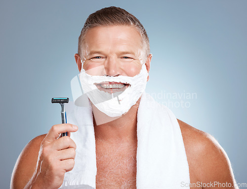 Image of Shaving foam, happy man and portrait with cream and razor for face cleaning, wellness and skincare. Morning grooming and model with facial care and skin treatment to shave hair in a studio isolated