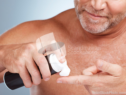 Image of Grooming, shaving cream and man in a studio for a hygiene, skincare and epilation face routine. Health, wellness and mature male with hair removal foam for a facial, self care and beauty treatment.