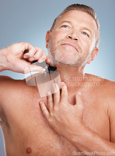 Image of Grooming, cleaning and man with razor for beard for wellness, healthy skin and hygiene on blue background. Beauty, skincare and face of male with barber shaver for facial, haircare and self care
