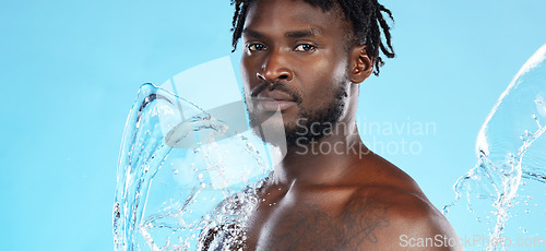 Image of Banner, shower and portrait of a black man with a water splash isolated on a blue background. Cleaning, beauty and African model for grooming treatment, hygiene and care of body on a studio backdrop