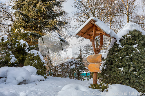 Image of beautiful signpost in winter garden