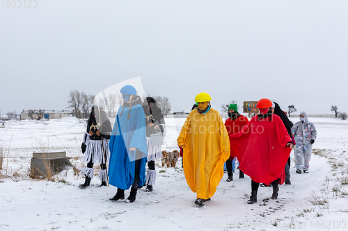 Image of People attend the Slavic Carnival Masopust