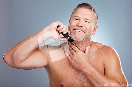 Image of Grooming, skincare and portrait of man with razor for beard for wellness, facial and hygiene on blue background. Barber, cleaning and face of male with shaver for self care, healthy skin and haircare