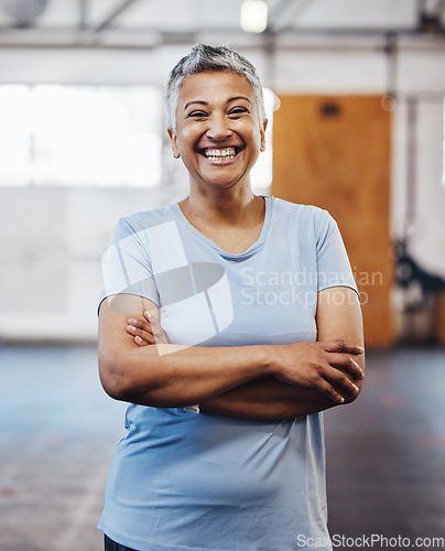 Image of Senior black woman, gym and smile portrait of a person happy about fitness and exercise. Sports, happy and pilates fitness studio of mature female with arms crossed proud about wellness and health